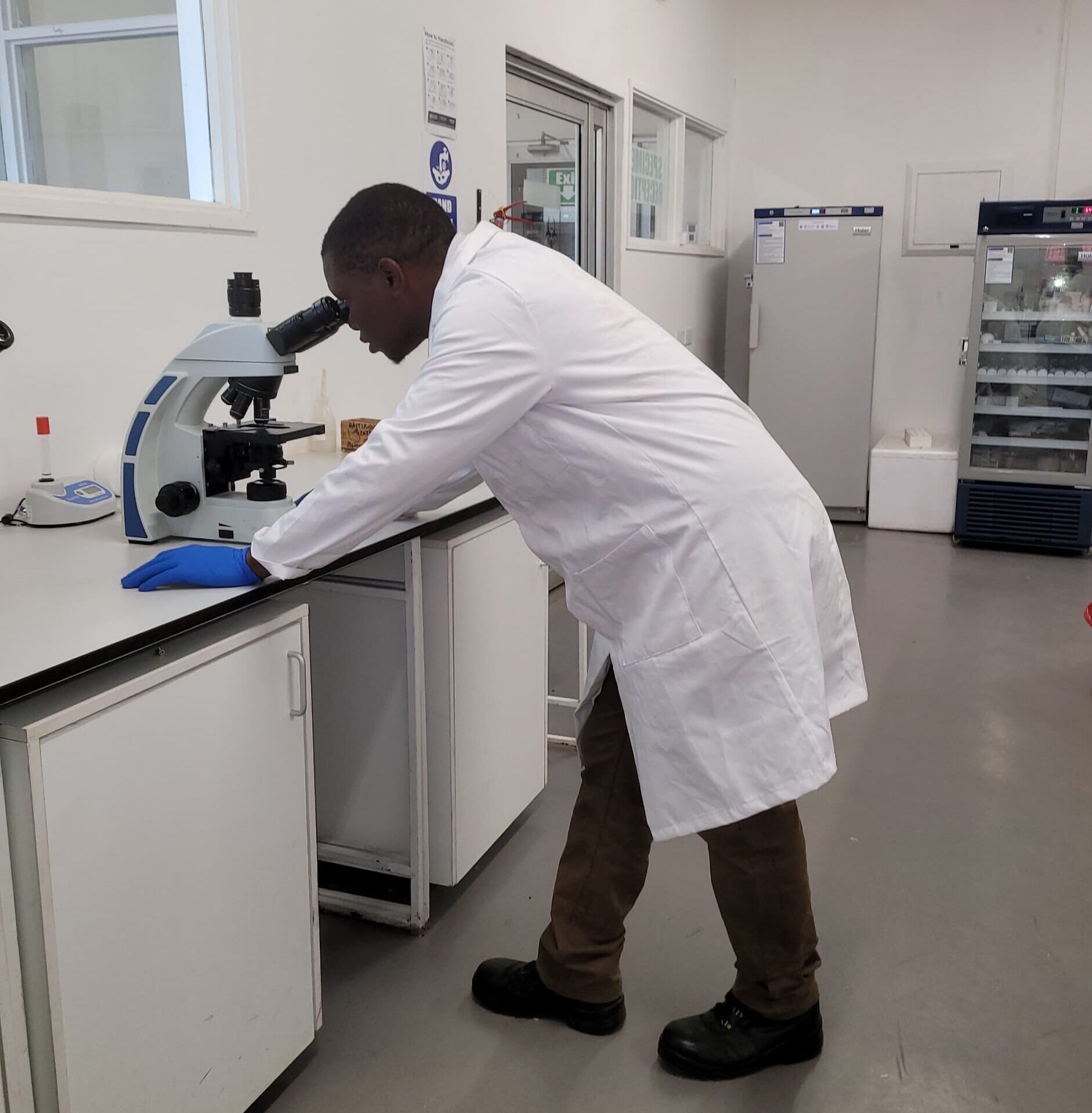 Peter working at a microbiology laboratory for genomics surveillance and outbreak detection (credit: SeqAfrica, DTU).